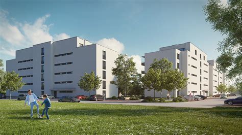 pohled na moderní bytový dům s parkováním a zelení